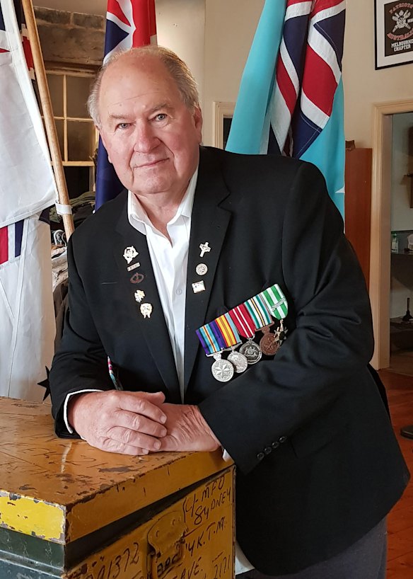 Vietnam veteran Greg Carter wears the medals he earned during his military service. 