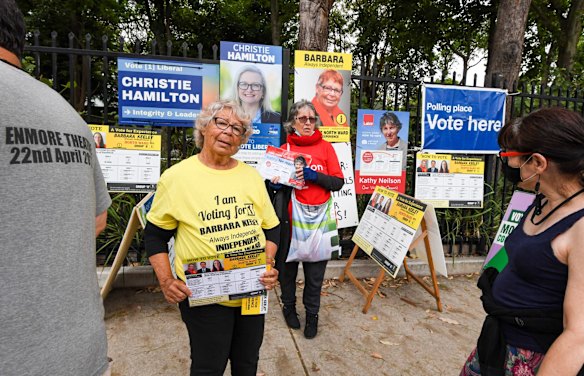 Early voters gather at Randwick Public School to cast their votes. Running as a Independent, Barbara Keely holds up her how to vote cards outside the school. She says she is the first, First Nation person to be running for Randwick City Council, which is one of Sydney's oldest Councils.