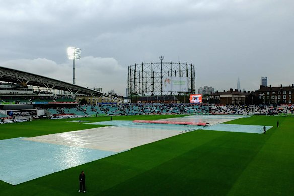 The covers are on as rain delays the start of play.