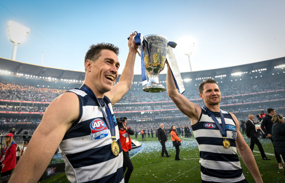 Jeremy Cameron and Patrick Dangerfield celebrate Geelong’s premiership last year. The annual captains’ survey predicts the Cats will again make the grand final this year.