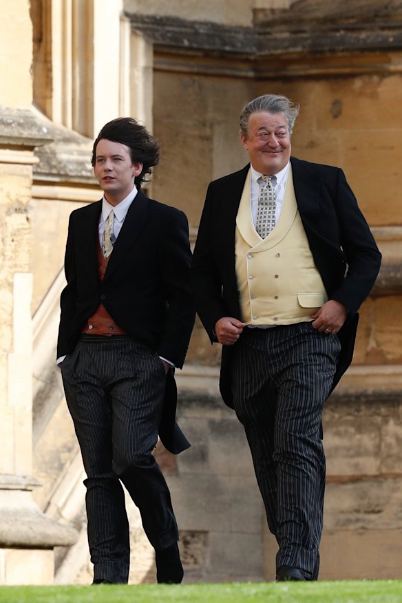 Stephen Fry, right, arrives with his husband Elliott Spencer to attend the wedding of Princess Eugenie of York and Jack Brooksbank.