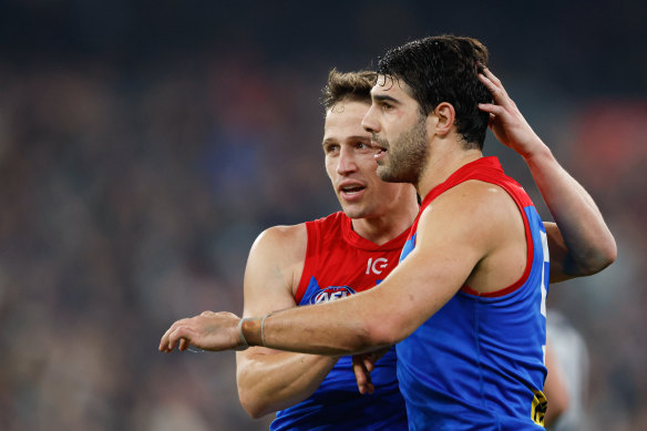 Jack Billings congratulates Christian Petracca on one of his five goals against the Blues.