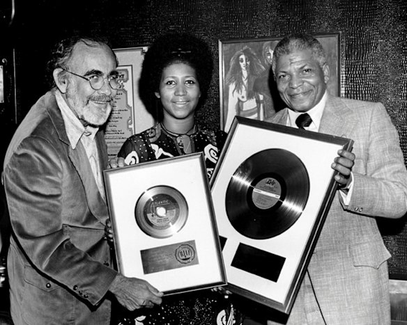 Former music producer and Atlantic records executive Jerry Wexler (L) is shown with recording artist Aretha Franklin (C) and Henry Allen in this 1971 publicity photo commemorating the gold record status of Franklin's "Spanish Harlem" 