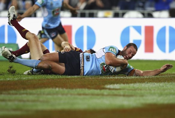 Boyd Cordner of the Blues scores a try.