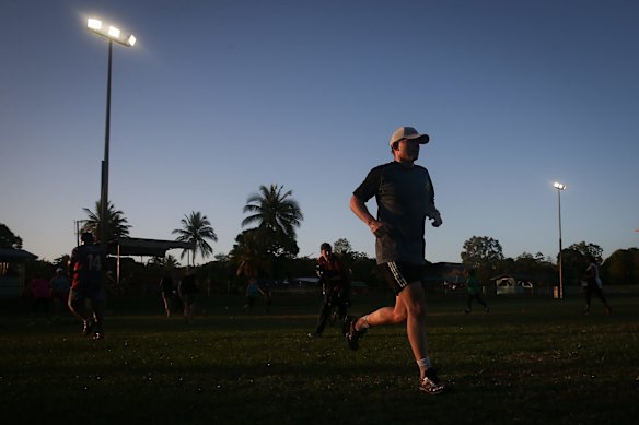 Prime Minister Tony Abbott doing physical training with members of the Bamaga community, during his visit to Cape York, on Friday 28 August 2015. 