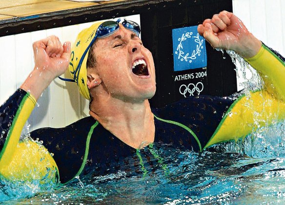 Petria Thomas celebrates after winning a gold medal in the 100-meter butterfly at Athens Olympic Games.