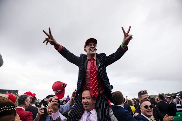 Punters celebrate Redzel winning the TAB Everest horse race held at Royal Randwick Racecourse.