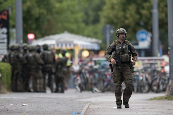 A police officer walks outside the Olympia mall in Munich.