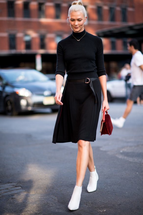 Model Karlie Kloss spotted in white boots during New York Fashion Week.