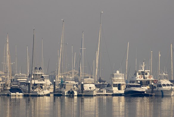 Smoke haze hangs over the marina at Batemans Bay.