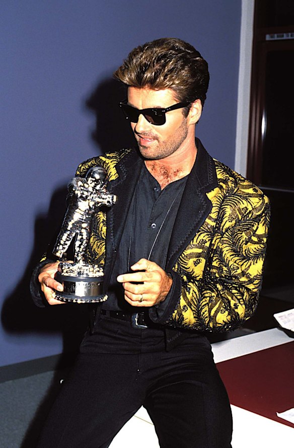 George Michael during 1989 MTV Video Music Awards in Los Angeles. High-wasted pants and bolero print jackets became a staple.