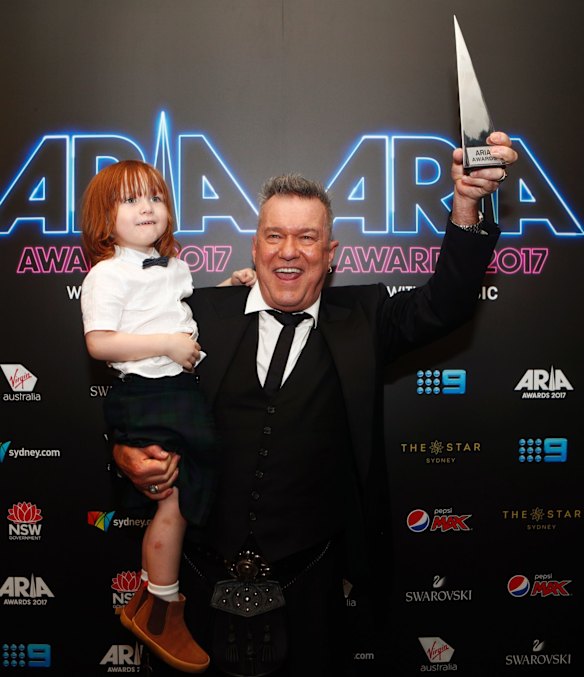 Jimmy Barnes and his grandson Dylan pose with the ARIA award for Best Children's Album at the 31st ARIA Awards at The Star, in Sydney.