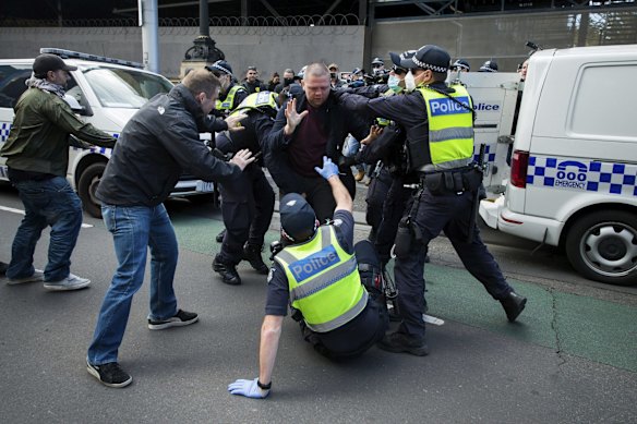 Ten people have been arrested in dramatic scenes after dozens of protesters gathered at Parliament House in Melbourne.