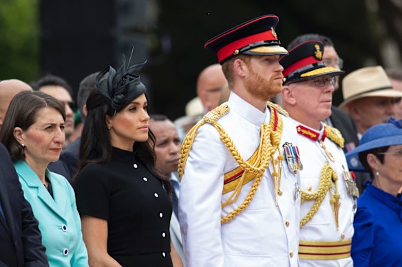 Britain's Prince Harry, center right, and his wife Meghan, center left, the Duchess of Sussex attend the opening of Anzac Memorial at Hyde Park in Sydney.
