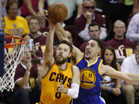 Matthew Dellavedova's game-three starring role: Dellavedova gets to the hoop despite Klay Thompson's defence.
