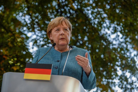 Angela Merkel addresses the media.