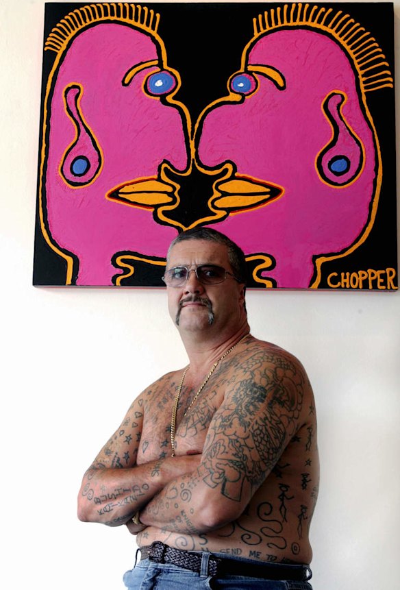 Mark Brandon Chopper  Reid, with one of his works on exhibition at the Michael Boyd Gallery , Collingwood in 2006.