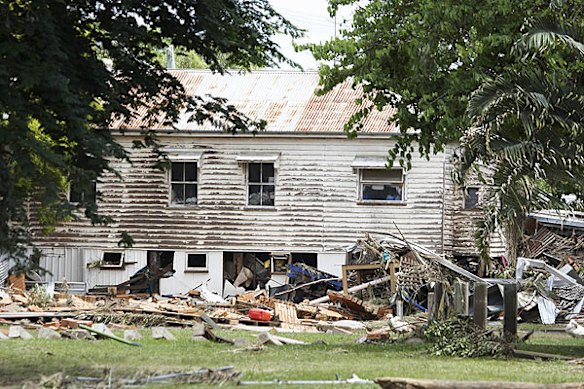 Emergency services search for bodies in the town of Grantham, in the Lockyer Valley, which was devastated by a sudden flood on January 10. Photo: Dean Saffron
