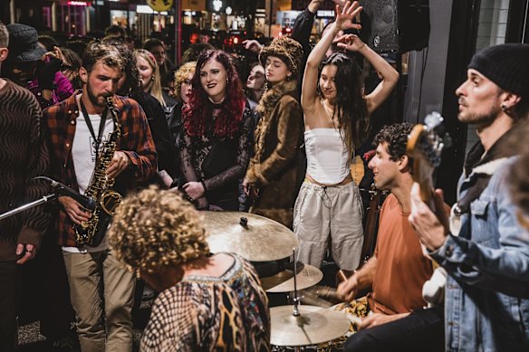 Local band The Seeding entertaining crowds on the streets.