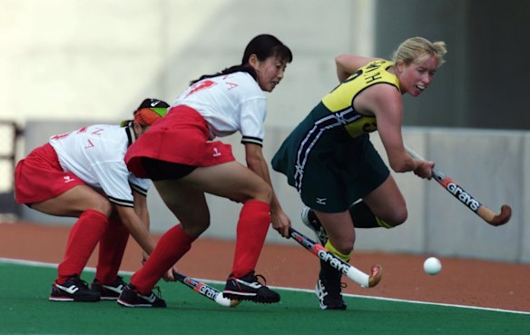  Karen Smith on the attack for Australia against China in the women's field hockey.