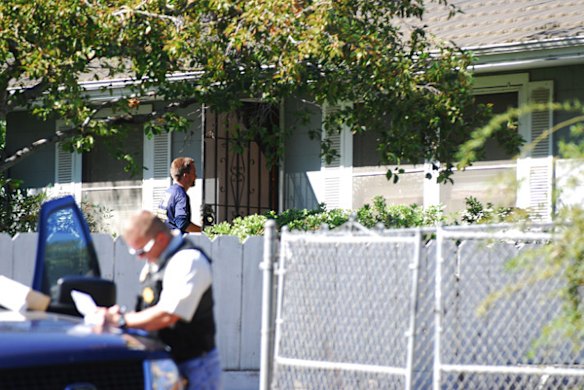 An FBI evidence response team member enters the house where  Phillip and Nancy Garrido were taken into custody.