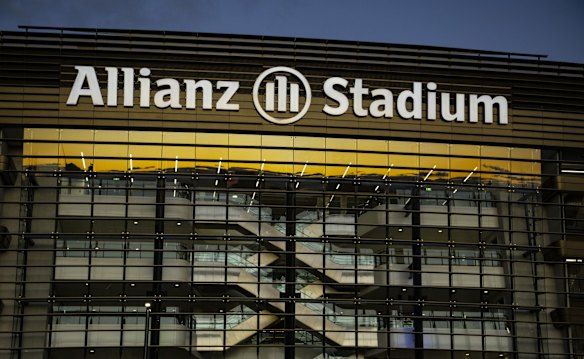 Stairs to the upper levels of the grandstand are visible through the external facade.