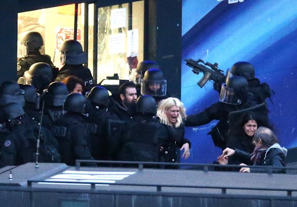 Police storm the building as hostages are freed. 