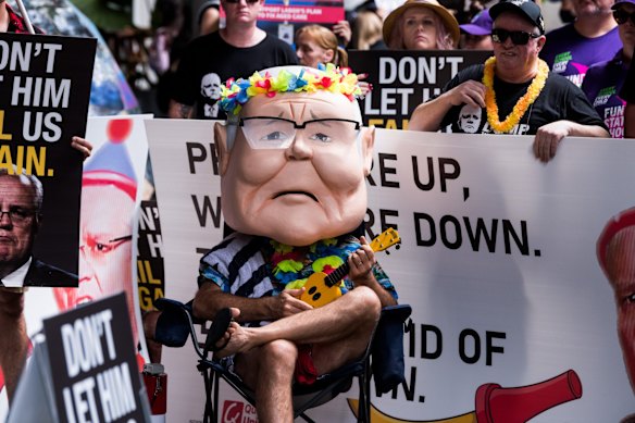Protesters outside the Brisbane Convention and Exhibition Centre for the official Coalition campaign launch.