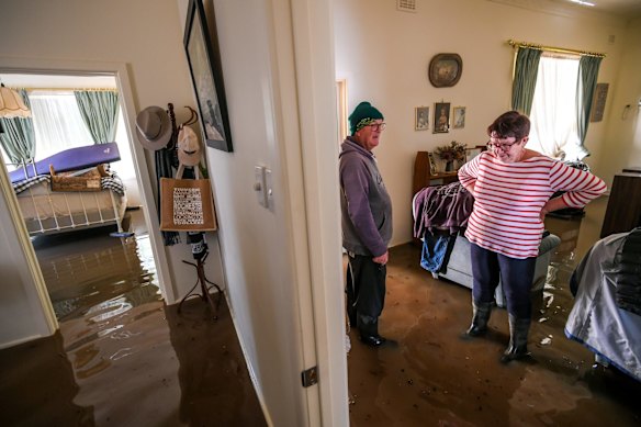 Brian and Glenys Mulcahy prepare to be inundated by floodwater, the fifth time they have been flooded in the 54 years they have lived in the Rochester family home.