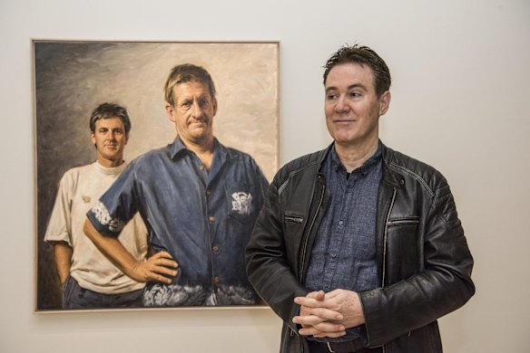Artist Paul Newton with his portrait of Roy and HG which is in the Century of the Archibald show.