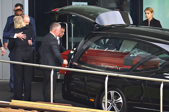 Jackson Warne is embraced by his grandfather Keith Warne.