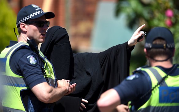 Police are conducting a raid at a home in Meadow Heights in relation to the Christmas terror plot in Meadow Heights. A woman spoke to police at the scene.