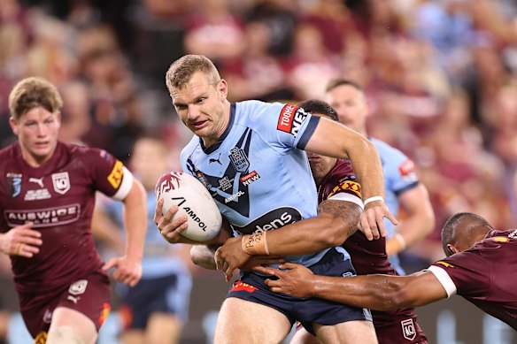 Tom Trbojevic of the Blues is tackled during game one of the 2021 State of Origin series.