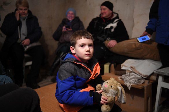 Mikhailo, 5, holds a puppet as he waits in an undergound shelter in Kyiv.