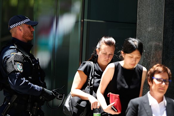  People evacuate a building next to the siege at Lindt Cafe in Martin Place.