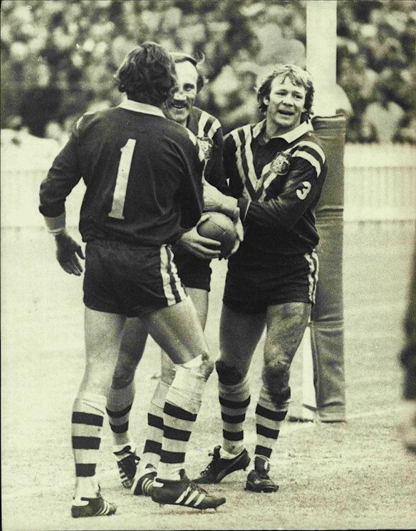 An elated Bob Fulton (right) congratulates Mark Harris after the big winger's try in 1975.