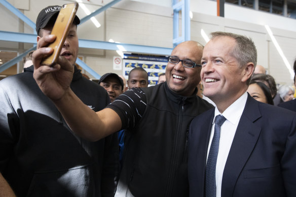 Bill Shorten poses for a selfie during a marginal seat visit in Melbourne.