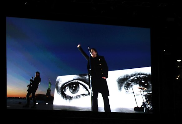 U2 appears on screen as they perform <i>Get Out of Your Own Way</i> on the Hudson River for the 60th annual Grammy Awards.