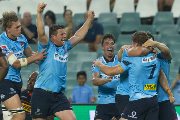 Victory: The Waratahs celebrate their last-minute victory over the Stormers.