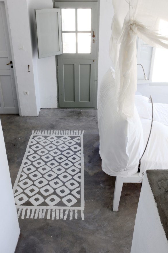 Painting rugs on the floor helps to soften the industrial look of the concrete.