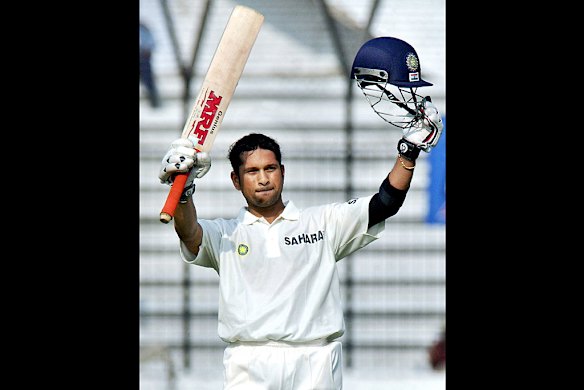 Tendulkar celebrates a century during a Test match between Bangladesh and India in 2004.