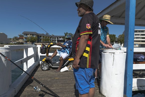Booraja Home Care clients Clark Chatfield and Robert Reynolds out fishing with Booraja Home Care worker Jayed Miller.