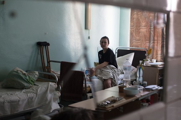 Natalya Vakula, aged 44, who was injured during shelling in Chernihiv on March 16, rests in a hospital in Brovary, Ukraine. Ukrainian forces have managed to largely halt the Russian advance around the capital, but shelling and airstrikes persist.