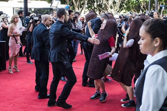 A person dressed as a sausage attempts to disrupt the AACTA Awards 