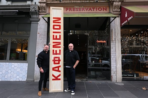 Con Christopoulos, right, and Stavros Konis with the Kafeneion sign that now dominates the dining room.