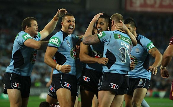 NSW celebrate their first try.