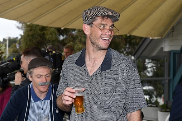 Tom Hawkins celebrates with teammates