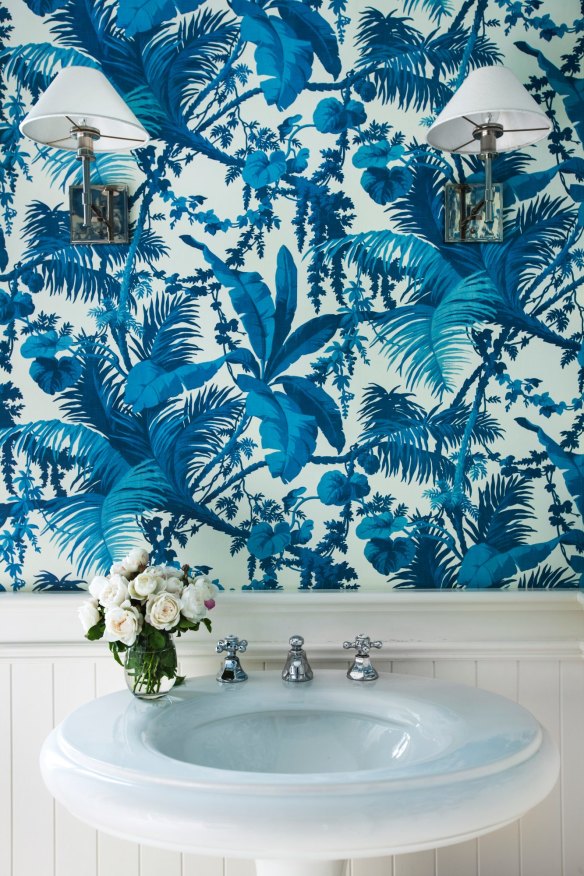 “My mum always said the bathroom is one space where you can go wild with wallpaper.” The paper is by House of Hackney