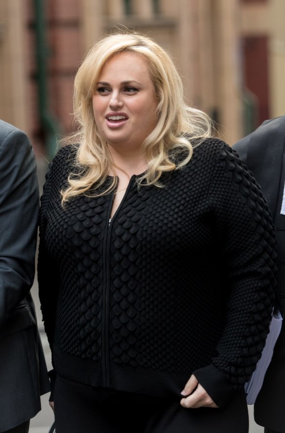If the jacket fits ... Rebel Wilson pictured on Friday wearing a black version of the pink jacket she wore on Monday.