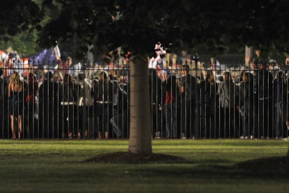A flash mob gathers at the White House gates.